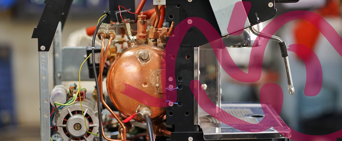 Inside a commercial espresso machine during servicing